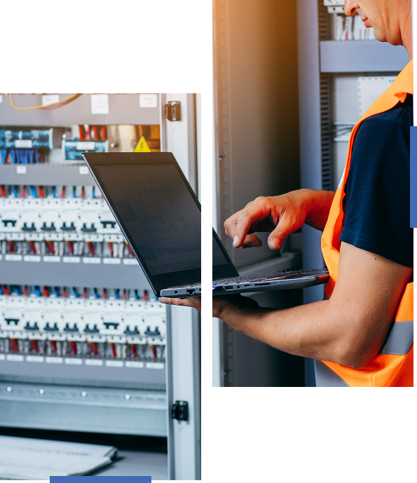 Person working on a laptop near an open vending machine.